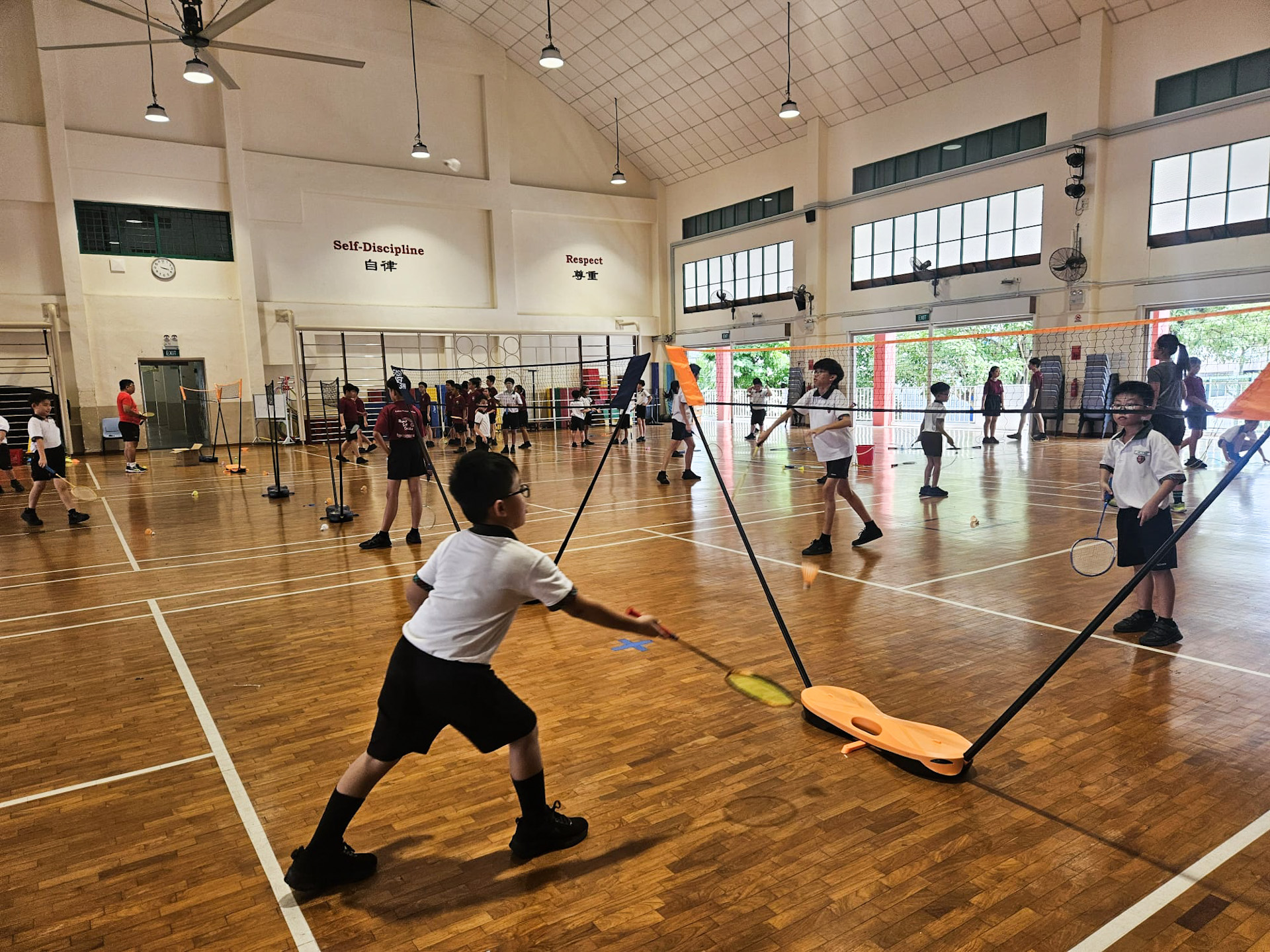 Students  to rally the shuttlecock across the net while improving coordination and control