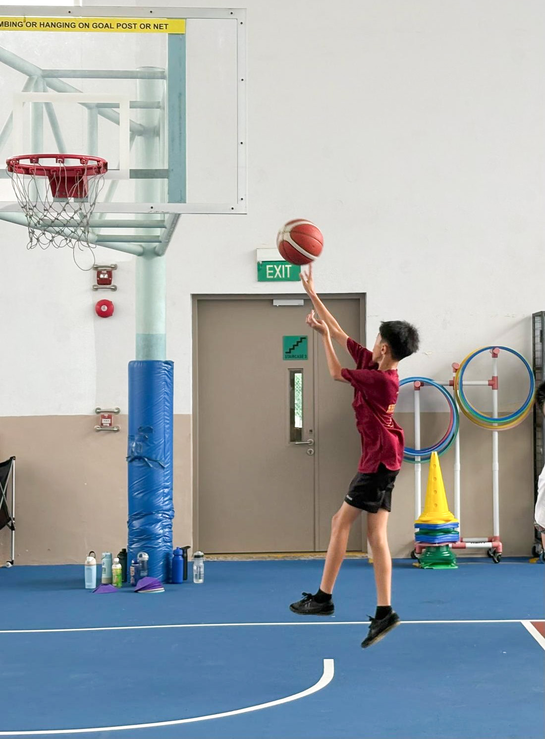 Student practising his basketball shooting skills